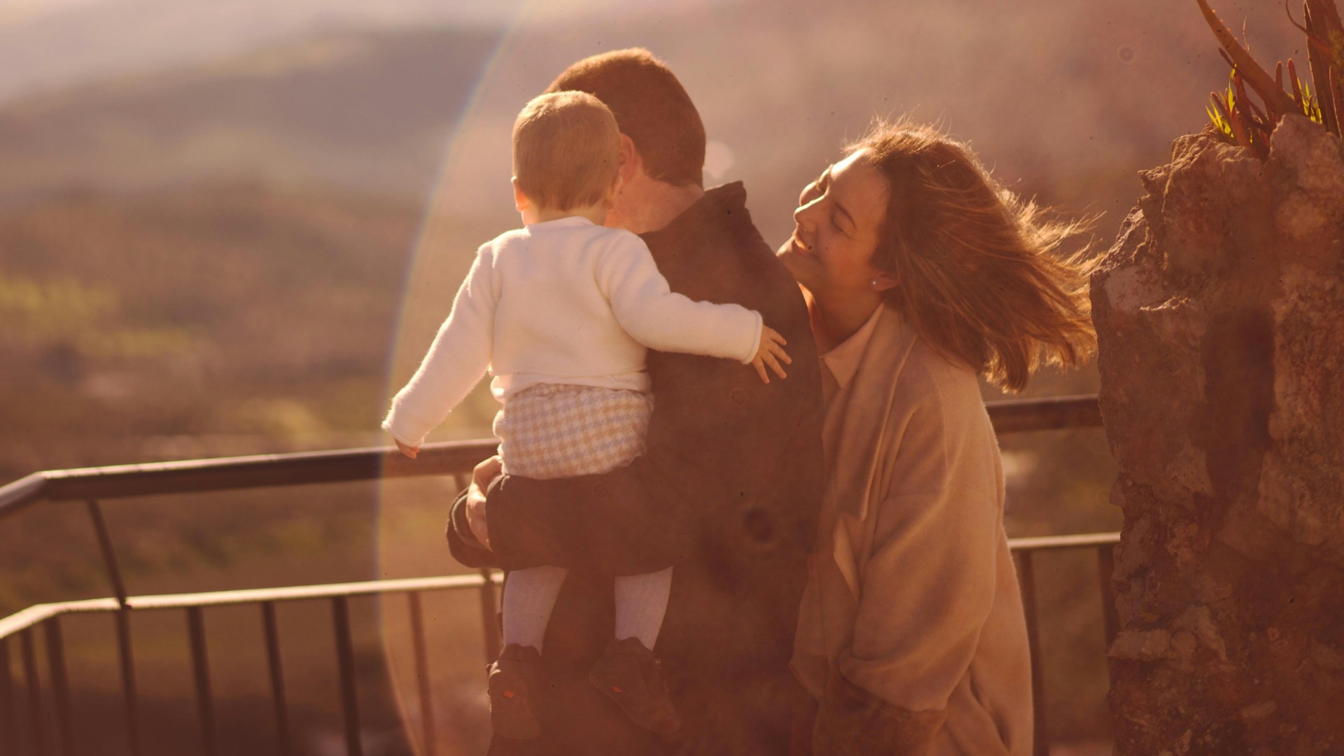 Mother and child in golden hour silhouette